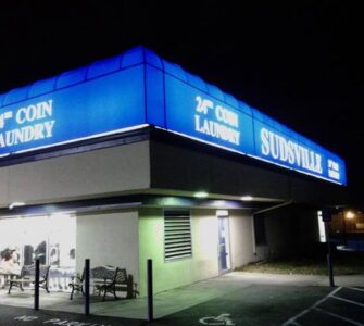 Illuminated, backlit canopy w/ graphics for coin laundry by Baltimore Canvas Awnings